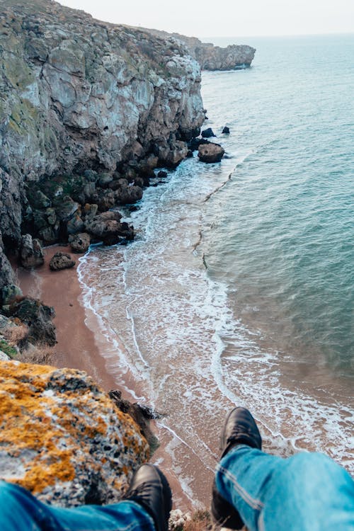 Man Sitting on the Cliff