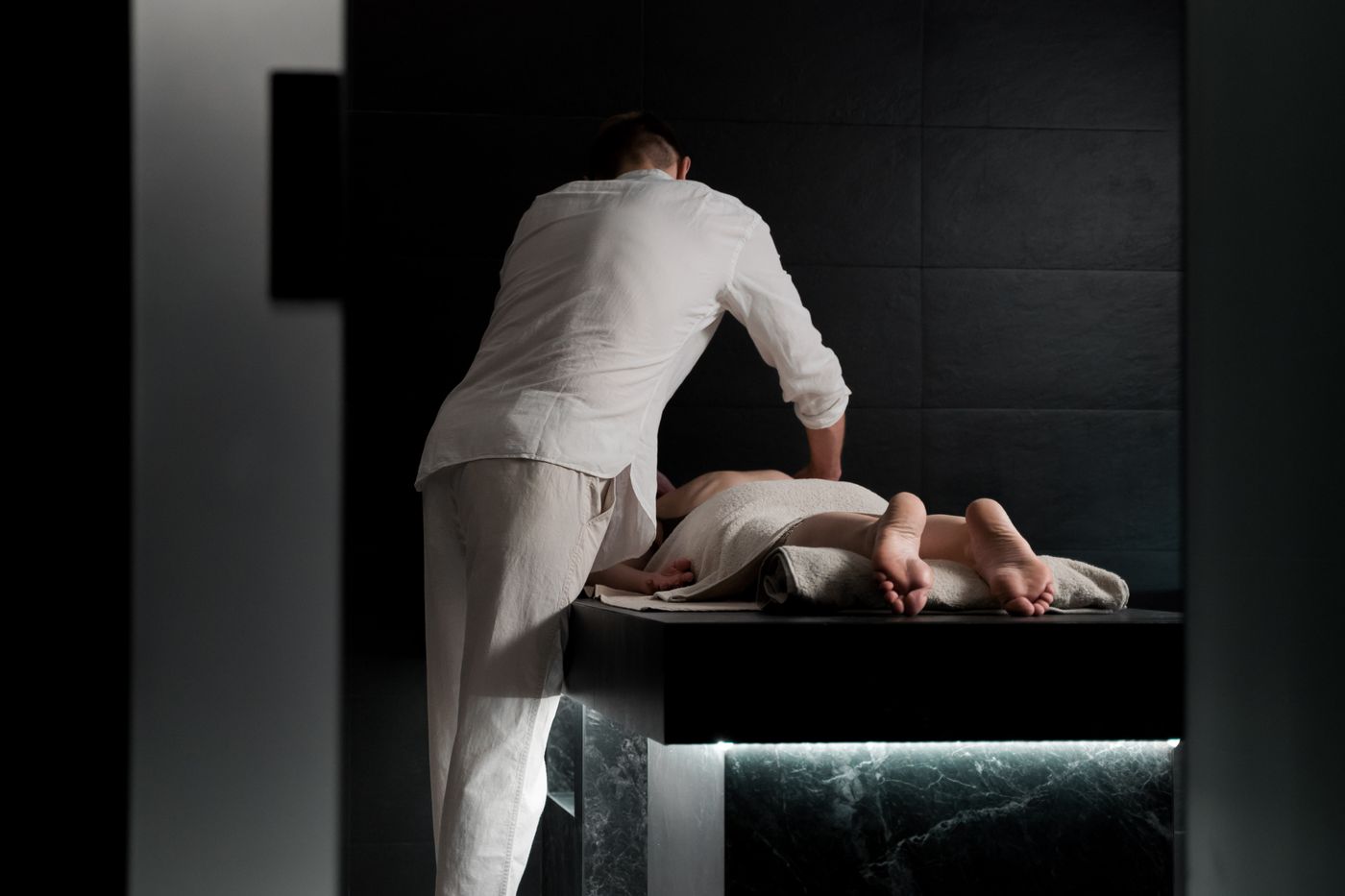 Calm spa treatment room during a massage, focused on wellbeing
