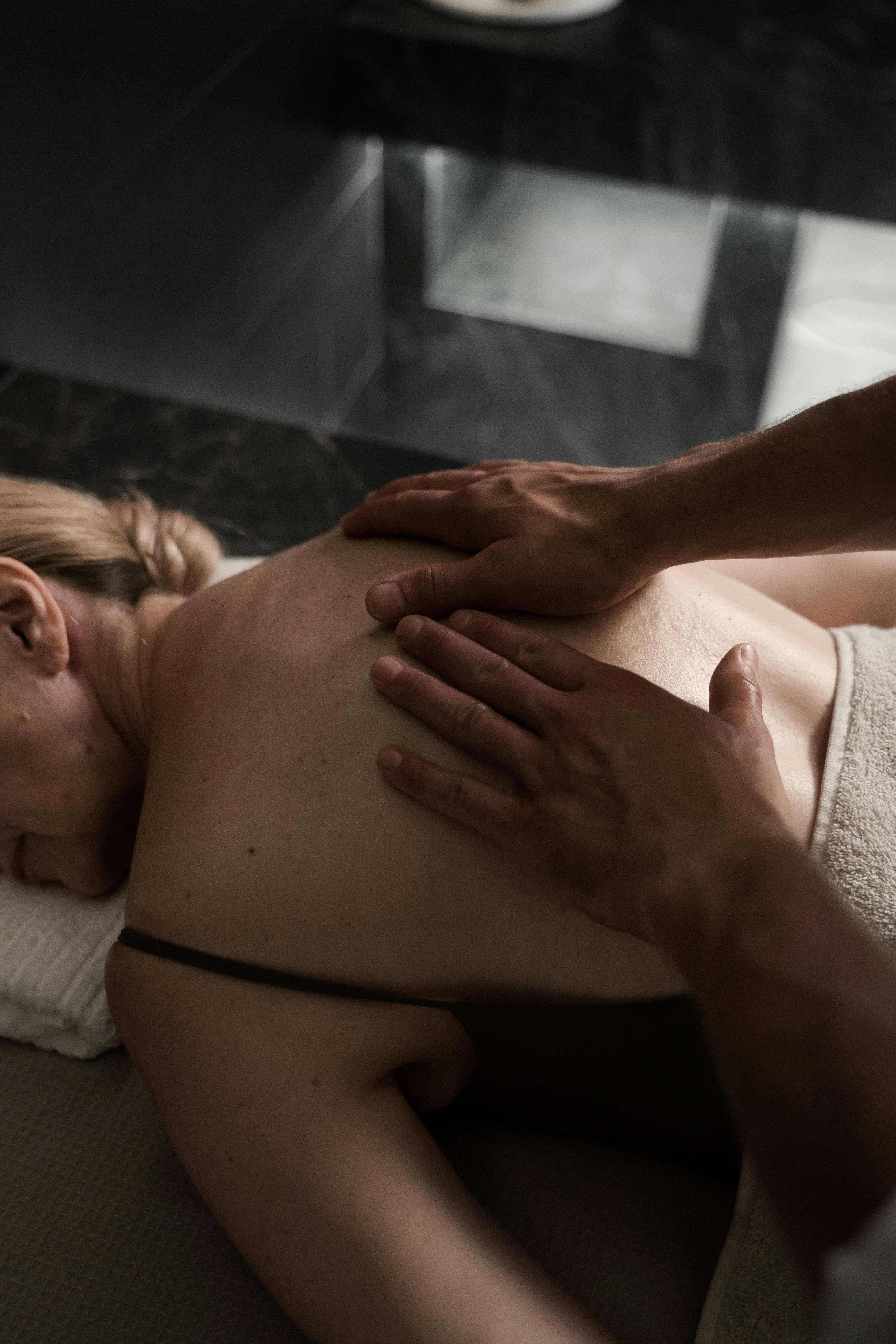 Close-up of a soothing back massage session promoting relaxation and wellness.