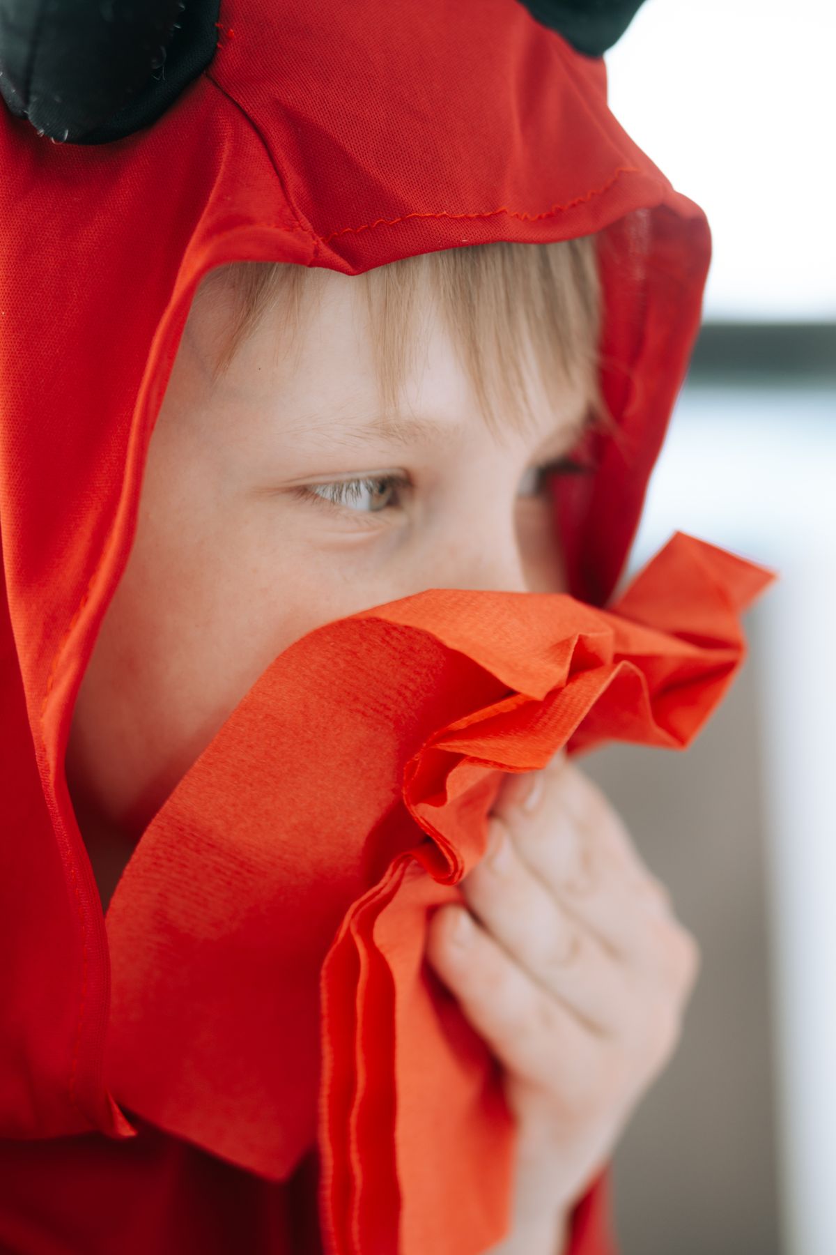 Child rubbing eyes — a common sign of allergic conjunctivitis