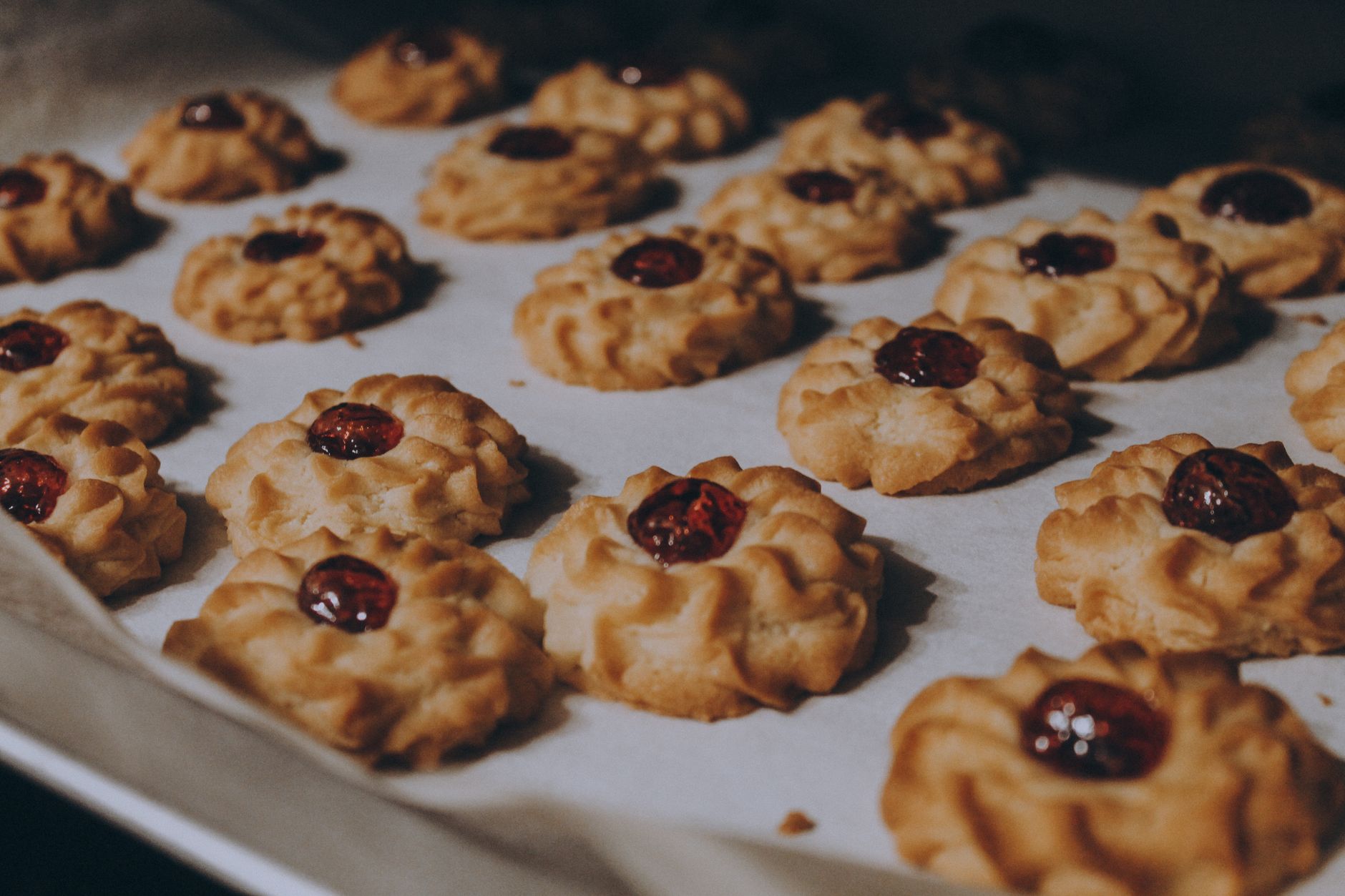 Traditional Chinese almond cookies fresh out of the oven on a baking sheet