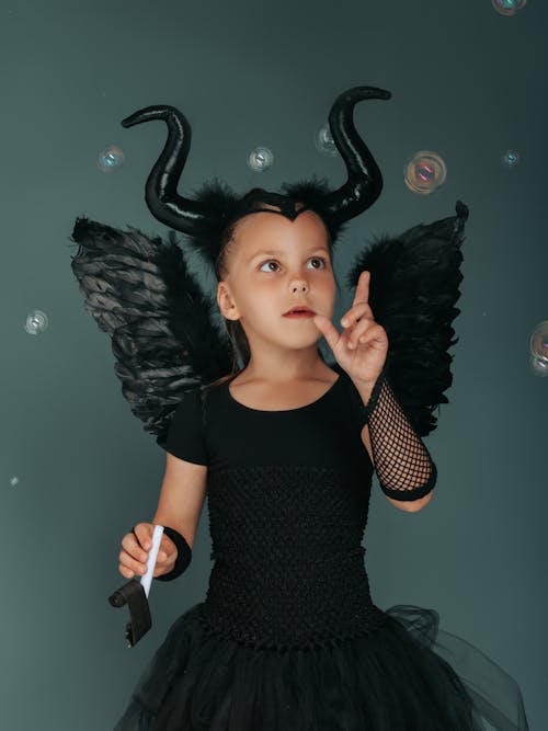Girl in Black Tutu Costume Dress Playing with Soap Bubbles
