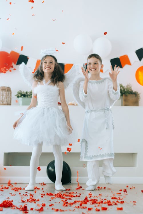 Free Children in Angel Costumes Having Fun Celebrating the Party Stock Photo
