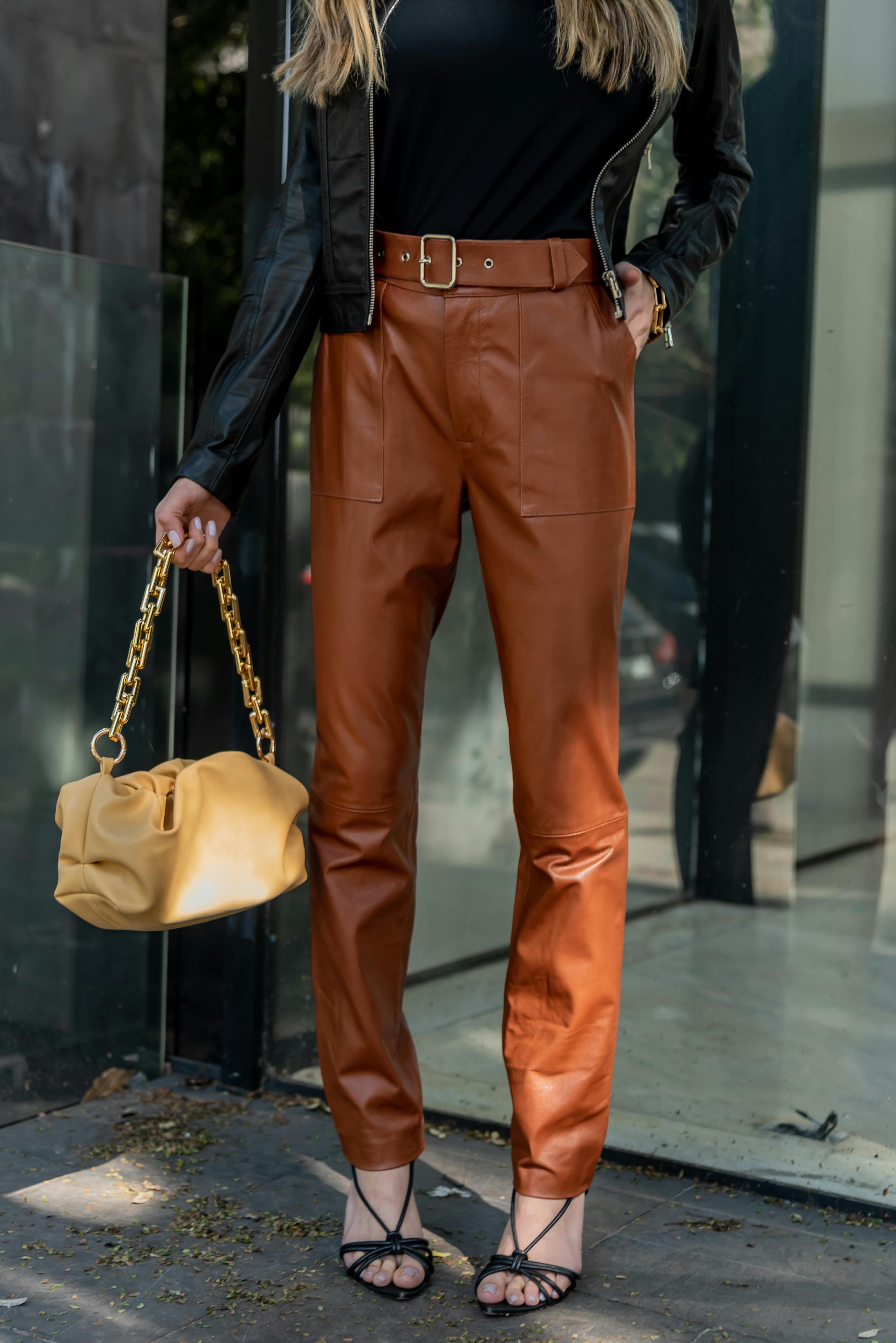 A Woman in Brown Leather Pants · Free Stock Photo