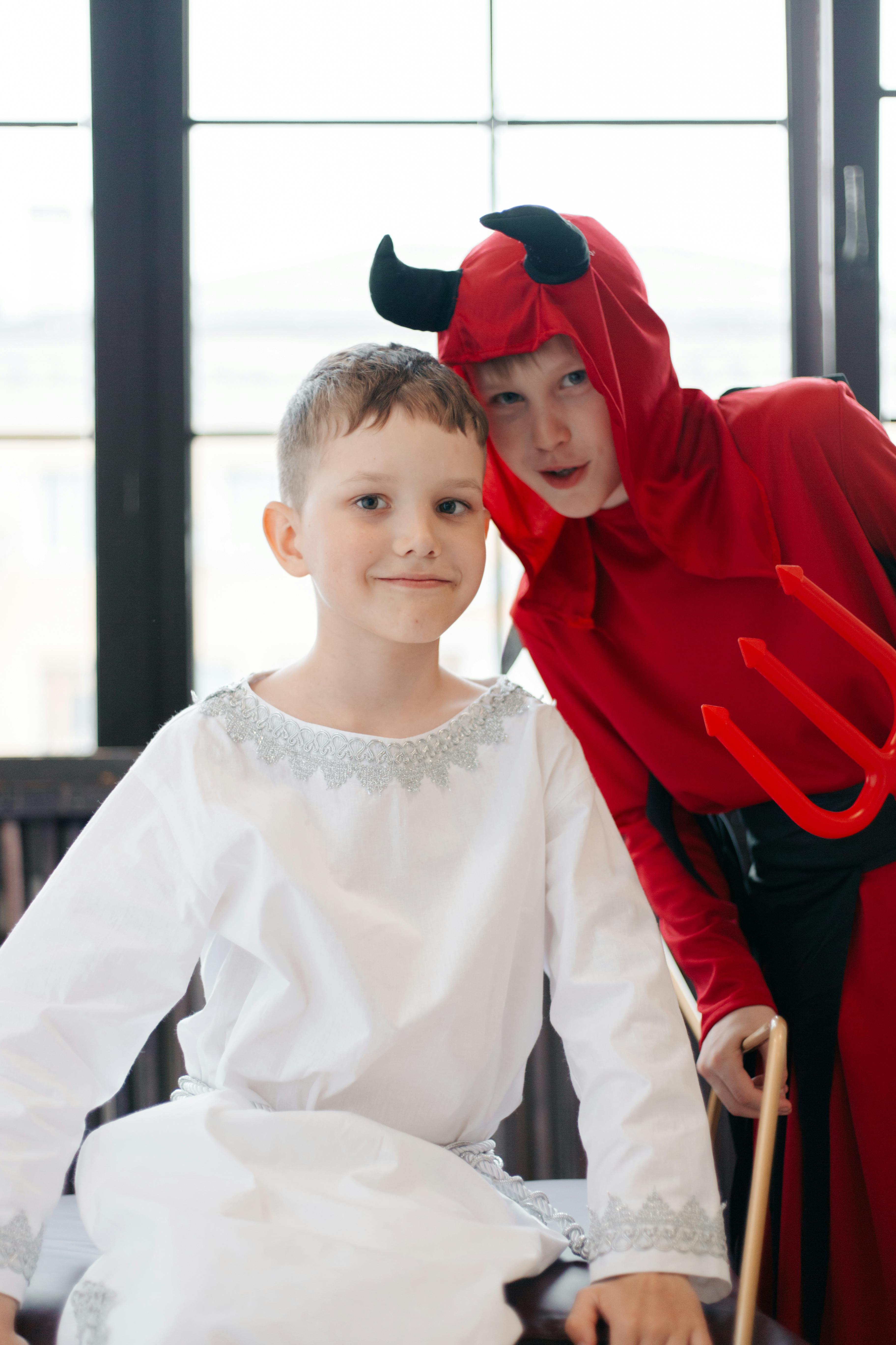 two boys in halloween costumes