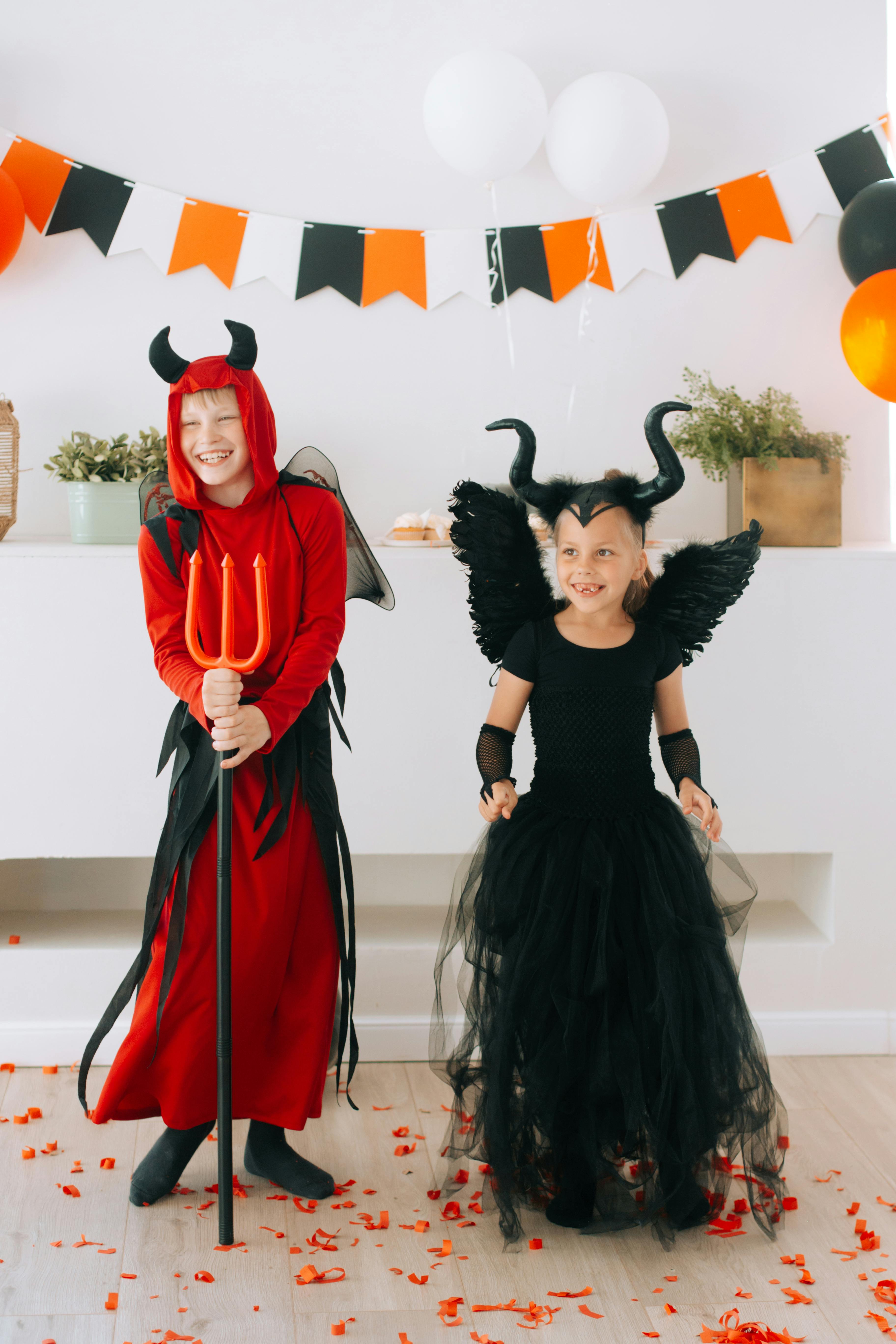 two children in halloween costumes