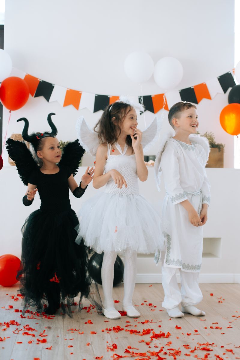 Happy children in Halloween costumes at a family-friendly party