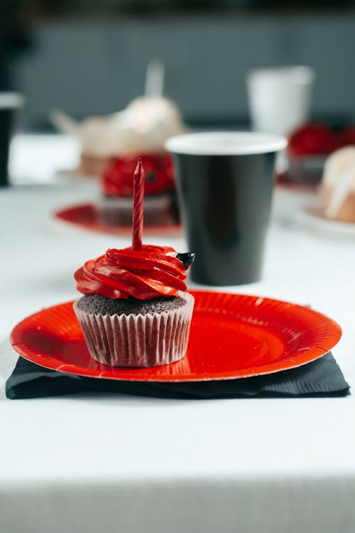 Free Chocolate Cupcake with Red Icing on Top  Stock Photo