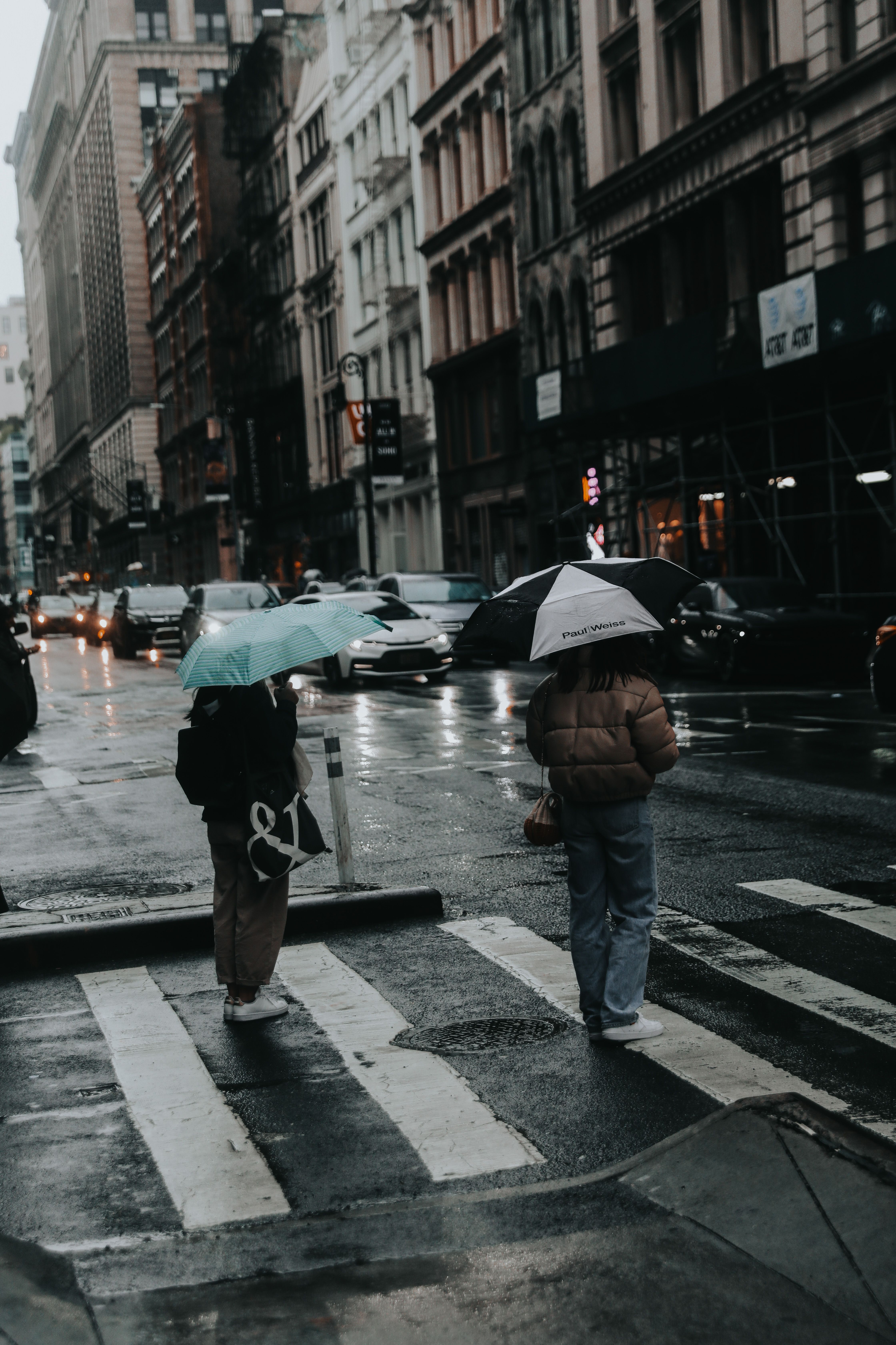 Grayscale Photo of People Crossing the Street on a Rainy Day · Free ...