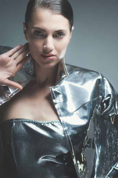 An Attractive Woman in Metallic Long Sleeves Posing