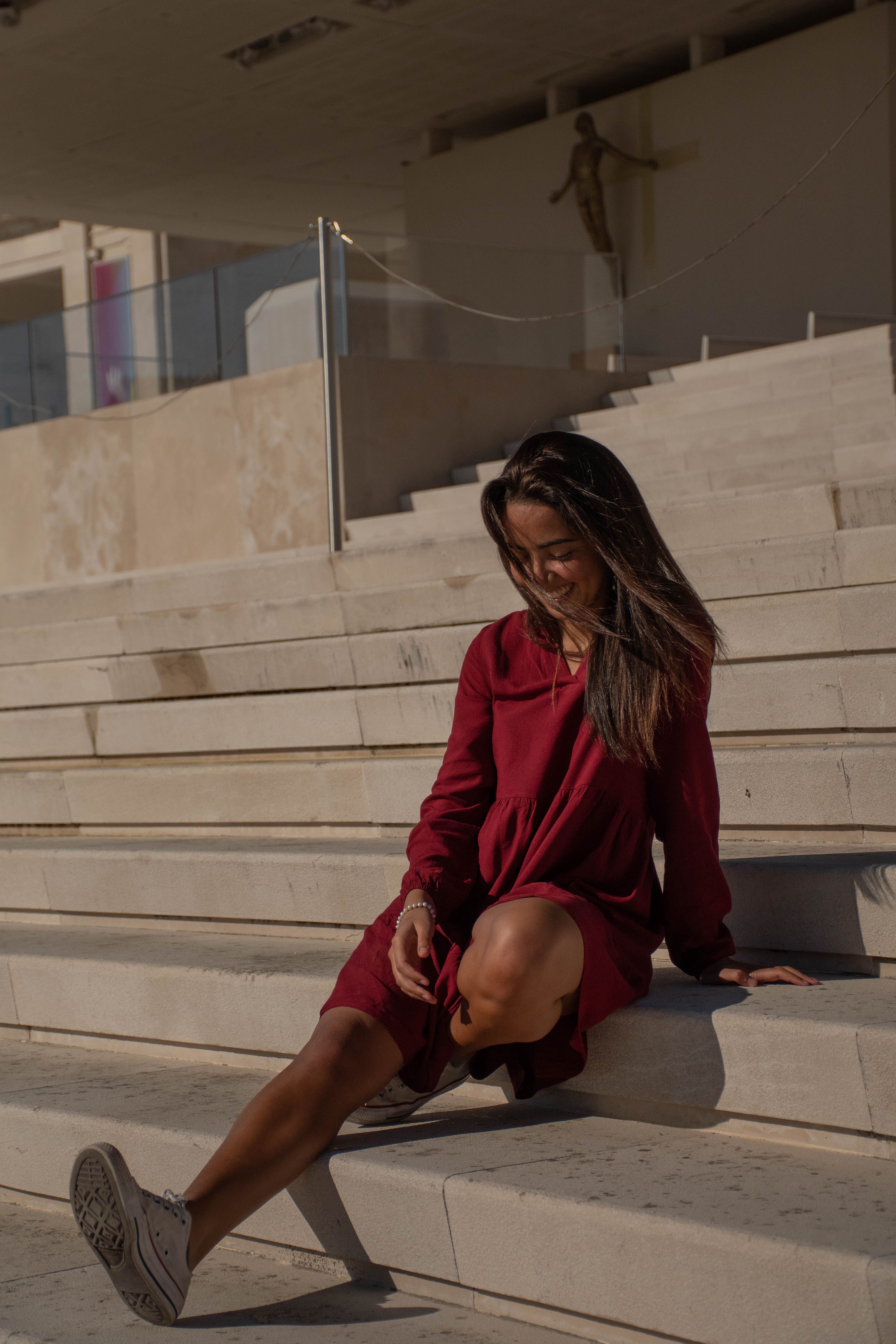 A Woman in Red Dress Sitting on the Stairs · Free Stock Photo