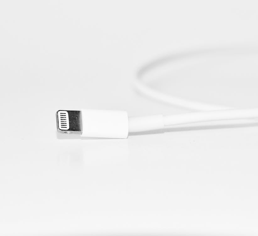 Close-Up Photography of White iPhone Charger