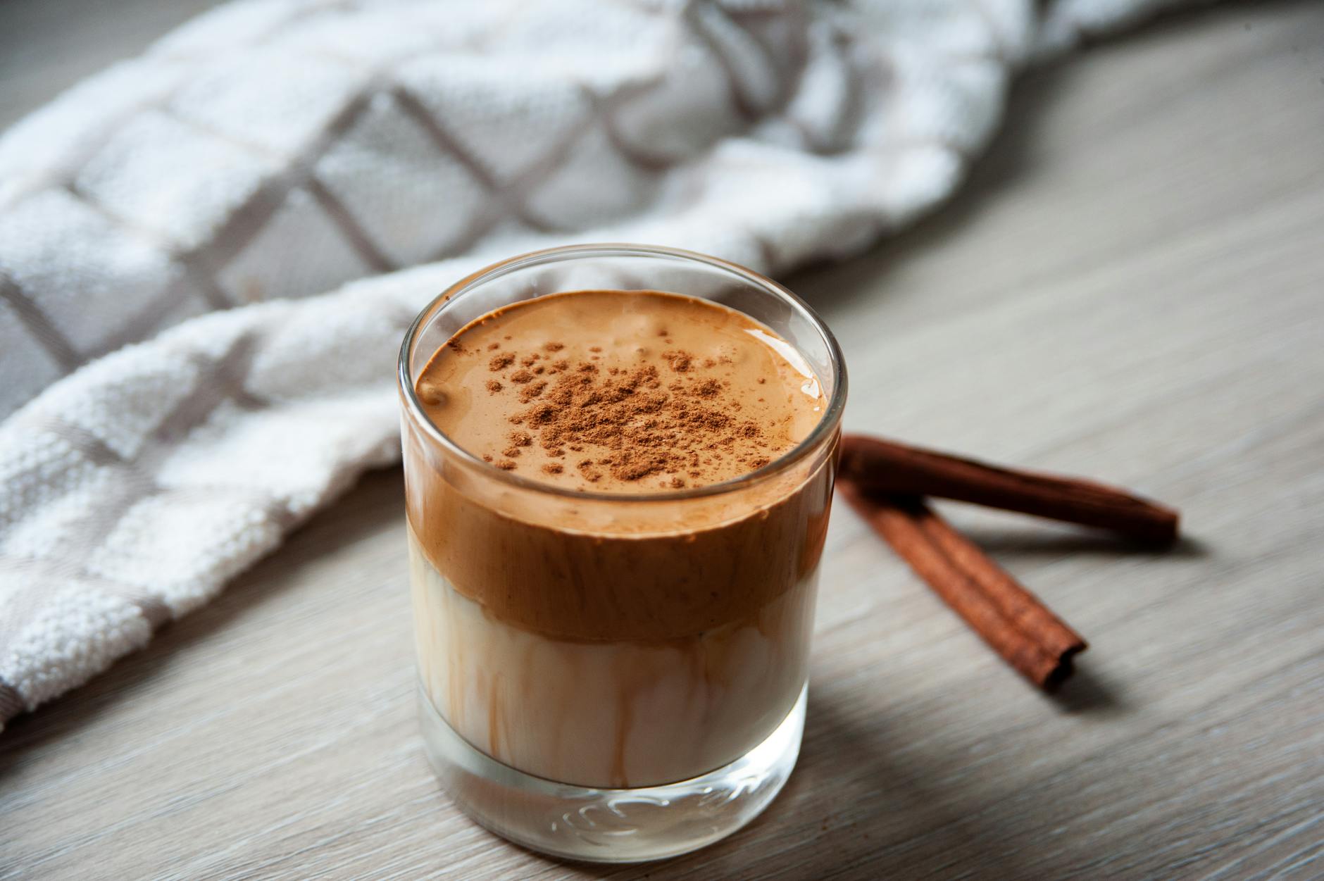 delicious creamy coffee topped with cinnamon dalgona foam, perfect for autumn mornings.