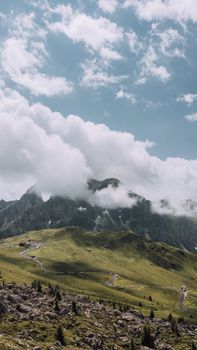 A stunning aerial view of cloud-covered mountains in Italy, showcasing nature's beauty.