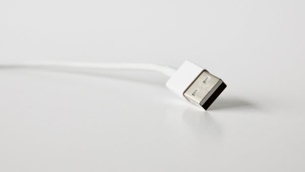 A detailed close-up image of a USB cable, perfect for technology-related projects. by Matthias Zomer