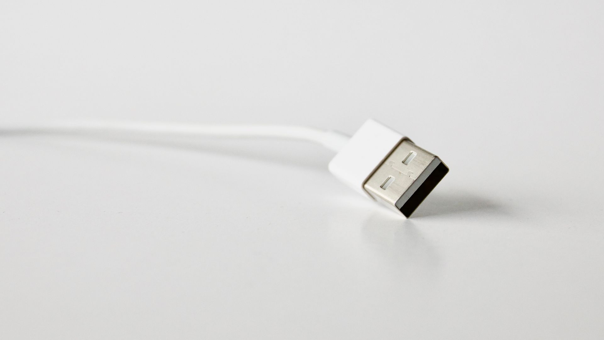 Close-Up Photo of White Usb Cable