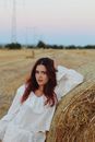 Woman in White Dress Shirt Standing on Brown Grass Field