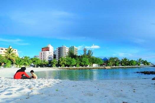 Enjoy a peaceful day by the sea in the Maldives with a scenic view of Fuvahmulah beach.