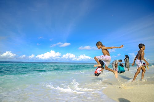 Kids Playing on the Seashore