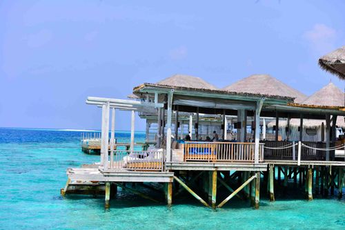 Free Scenic overwater bungalows in the crystal-clear Maldives, perfect for a tropical vacation. Stock Photo