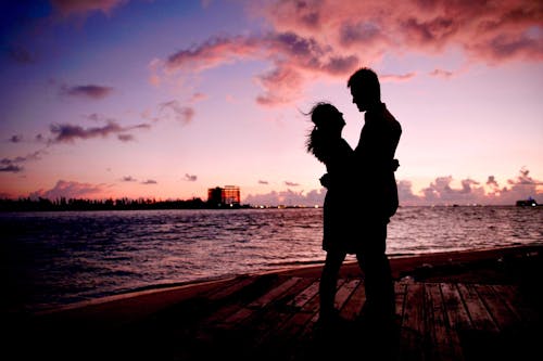 Silhouette of Couple Looking at Each Other