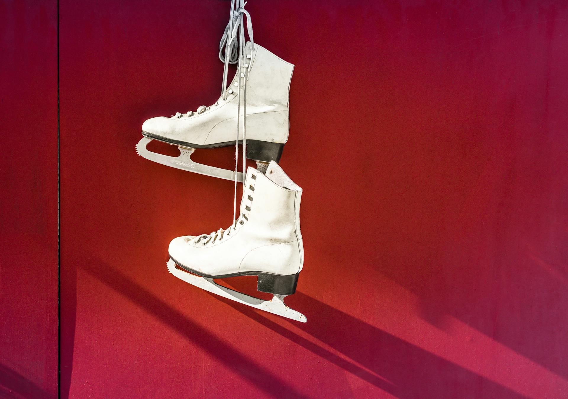 Hanged Pair of White Leather Figure Skates