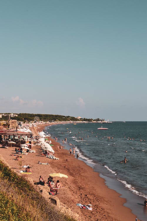 People on the Beach under the Sky