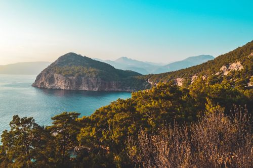 Free Breathtaking view of the Melanippe Peninsula with lush greenery and serene sea in Turkey. Stock Photo