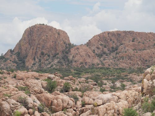 Brown Rocky Mountain Under White Cloudy Sky