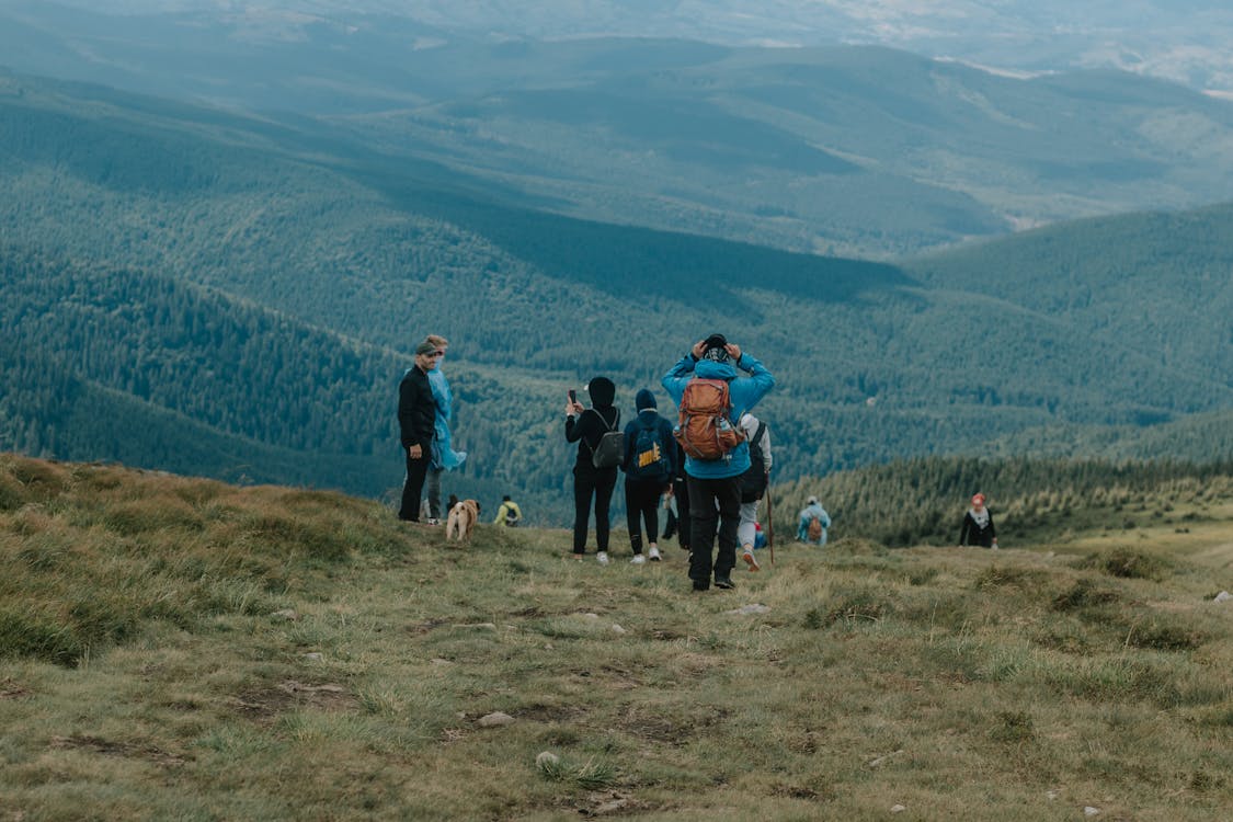 People Hiking in Mountains Area