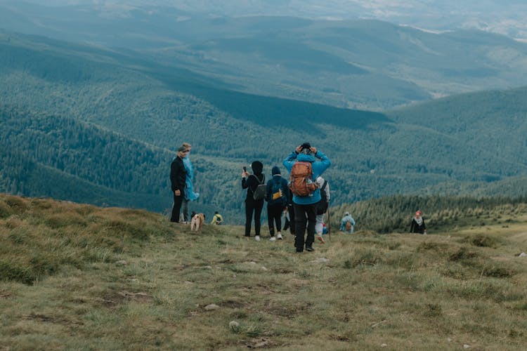 People Hiking In Mountains Area