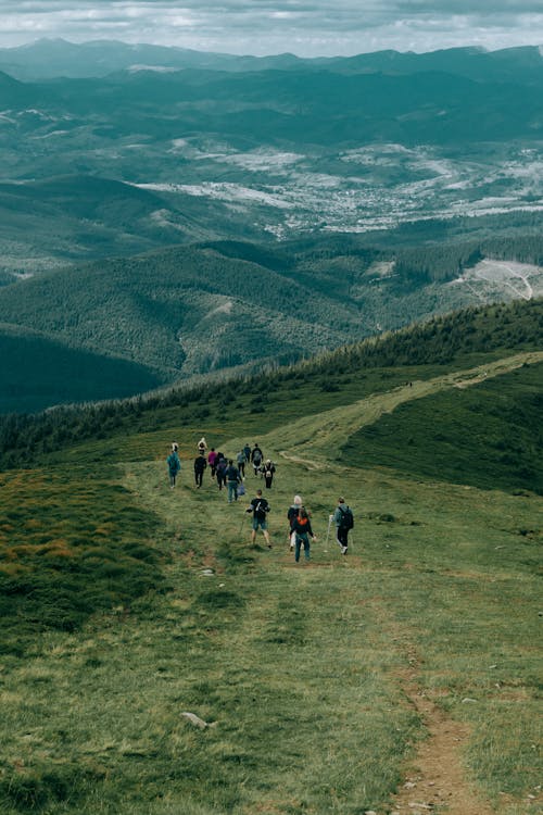 Free People Hiking on Green Mountain Stock Photo