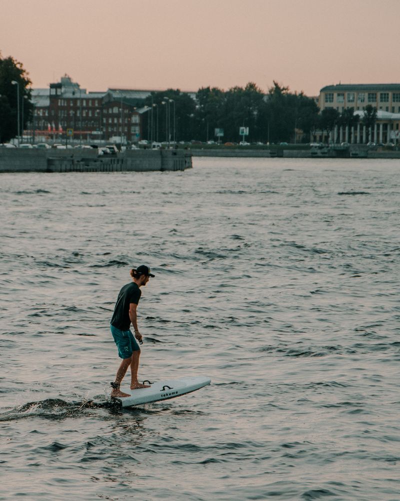 Man riding hydrofoil efoil surfboard