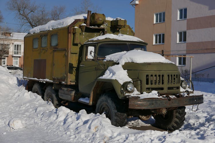 
A Parked Snow Covered Truck