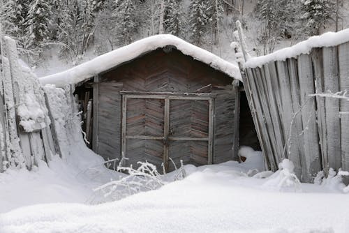 Free Wooden House Covered With Thick Snow Stock Photo