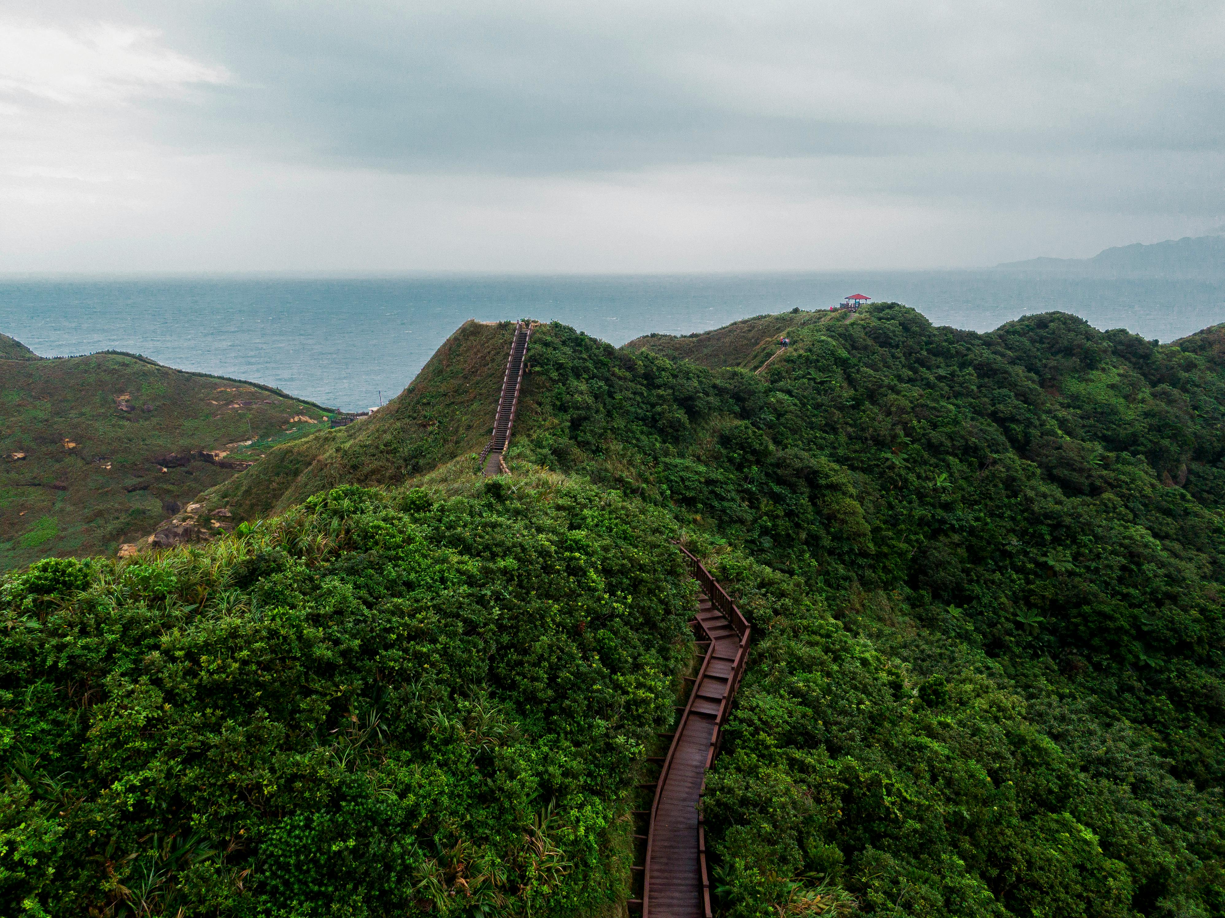 A breathtaking aerial view over the lush green Bitoujiao Trail in Ruifang District, New Taipei City, Taiwan
