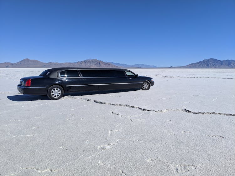 A Black Limo Parked On The Desert