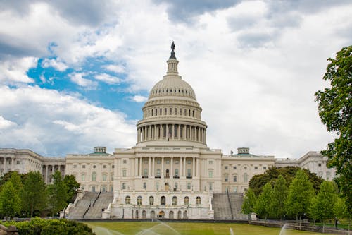 Free A Capitol Building Under the White Clouds and Blue Sky Stock Photo
