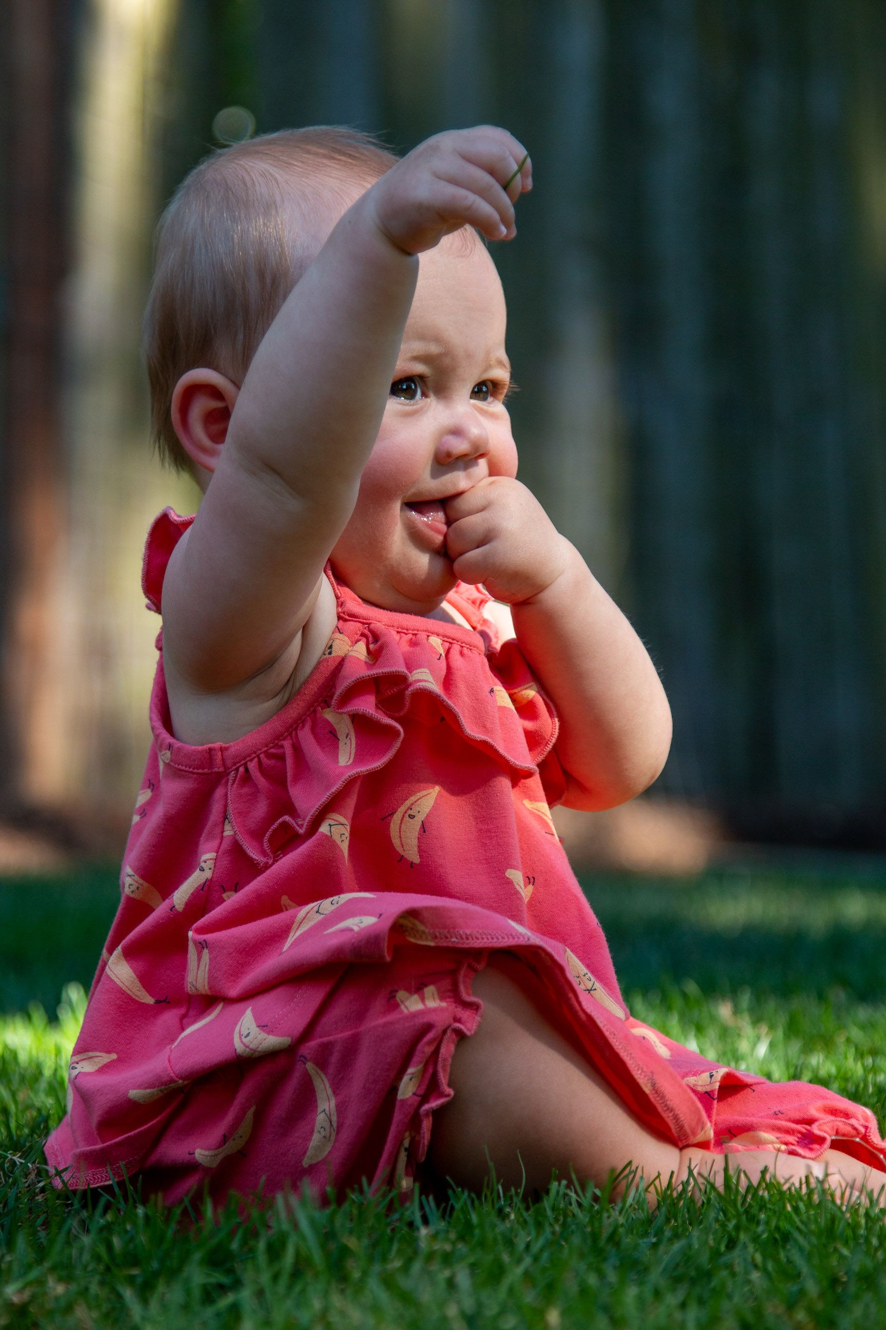 Baby Girl in Pink Dress Sitting on Green Grass · Free Stock Photo