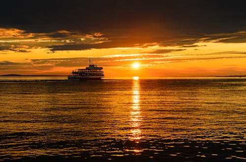 A Ferry Sailing on the Sea during Sunset