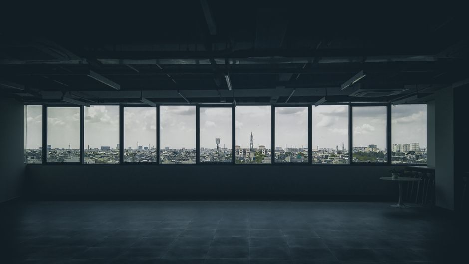 a floor-to-ceiling window view of a city skyline at sunset - high rise apartment rent a floor-to-ceiling window view of a city skyline at sunset - high rise apartment rent