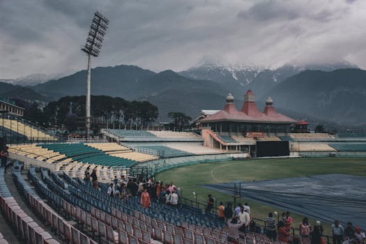 HPCA Stadium in India set against stunning mountains and cloudy skies, capturing the essence of outdoor sports venues.