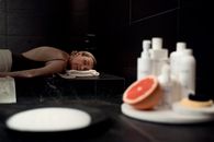 Baby Lying on Black and White Ceramic Sink