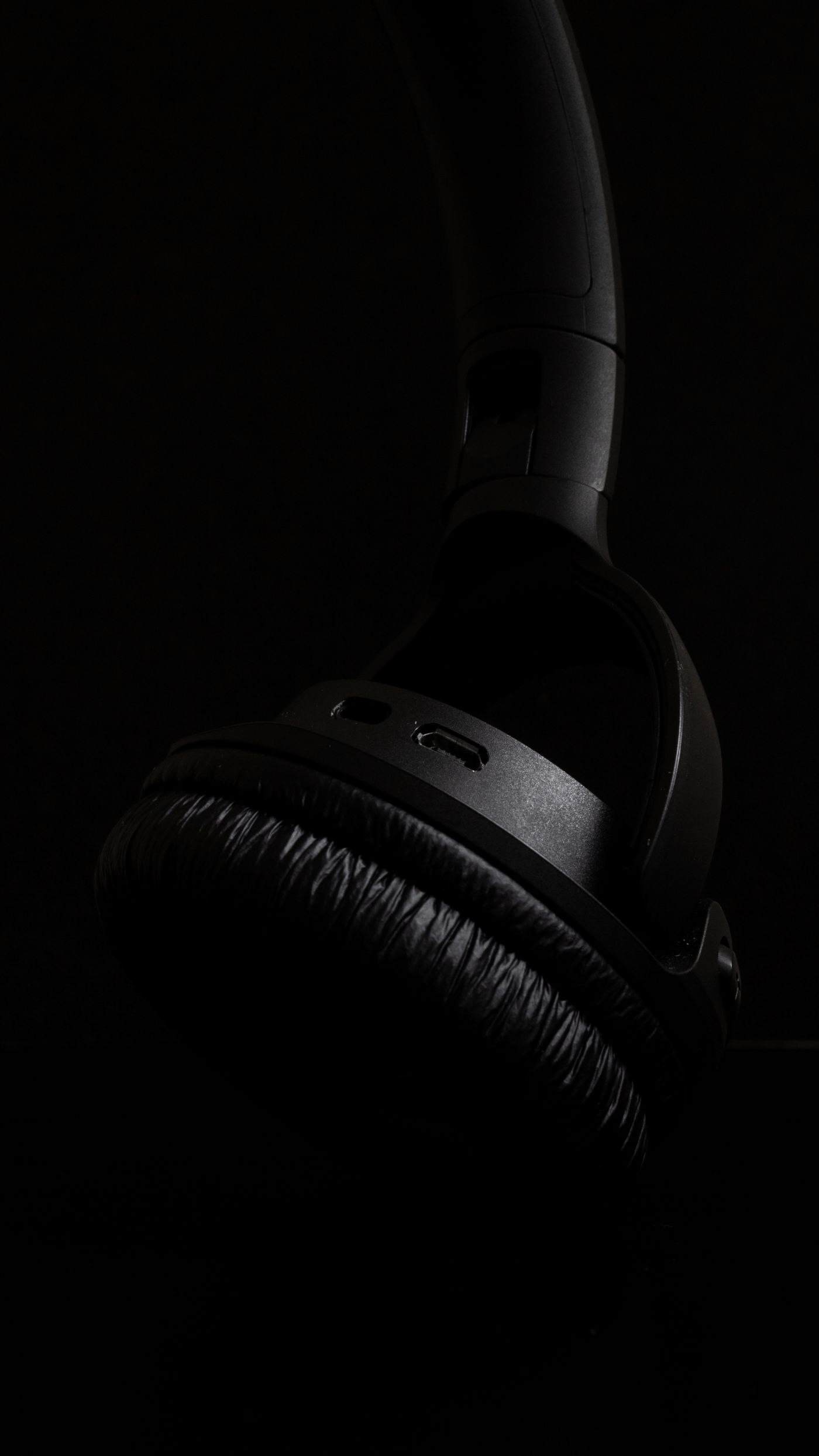 Close-up of unbranded black over-ear headphones
