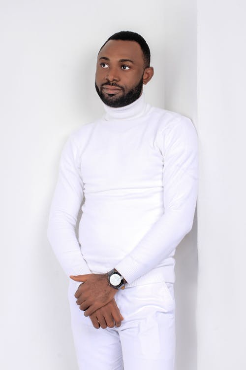 Free Photo of a Man Wearing a White Turtleneck Sweater and White Pants Stock Photo