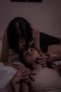 Woman in Black Tank Top Lying on Bed Beside Man in White Polo Shirt