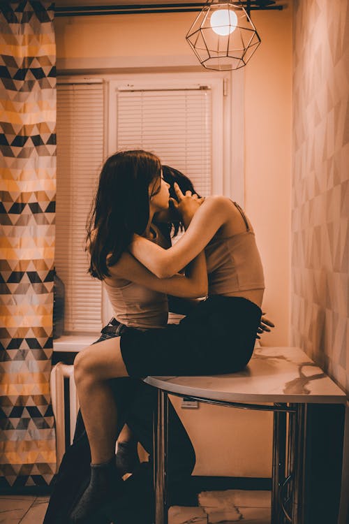 Women Hugging Inside a Room