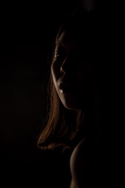 Silhouetted profile against a black background, photo by Ron Lach on Pexels