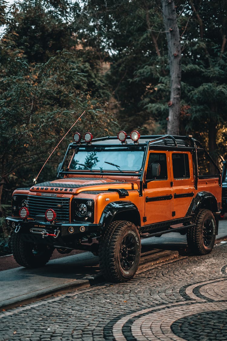 An Orange Land Rover Defender 