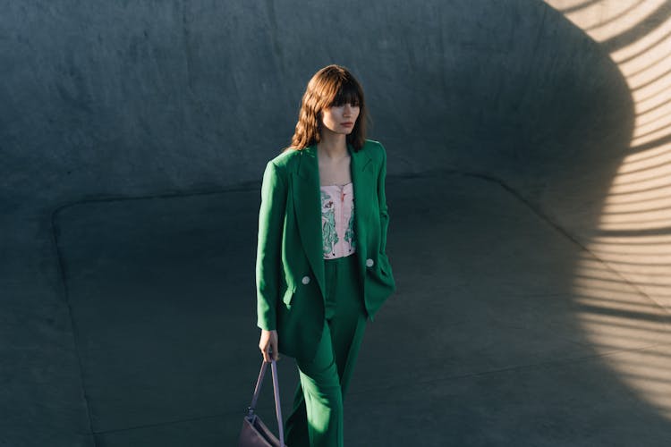 Woman In Green Blazer And Pants